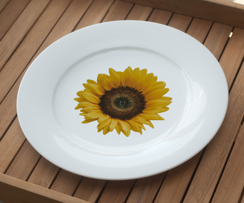 White plate with a sunflower illustration
