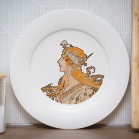 White plate with an Art Nouveau-style illustration of a woman in profile with an ornate headpiece