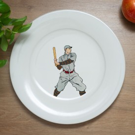 White plate with a vintage illustration of a baseball player holding a bat