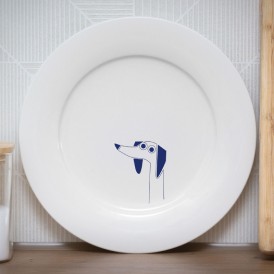 White plate with a minimalist blue dog illustration